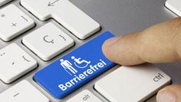 PC-Tastatur mit Finger Richtung mit Taste mit Piktogramm "Barrierefreiheit"